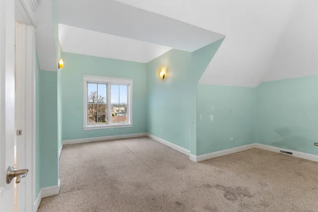 a view of a room with wooden walls