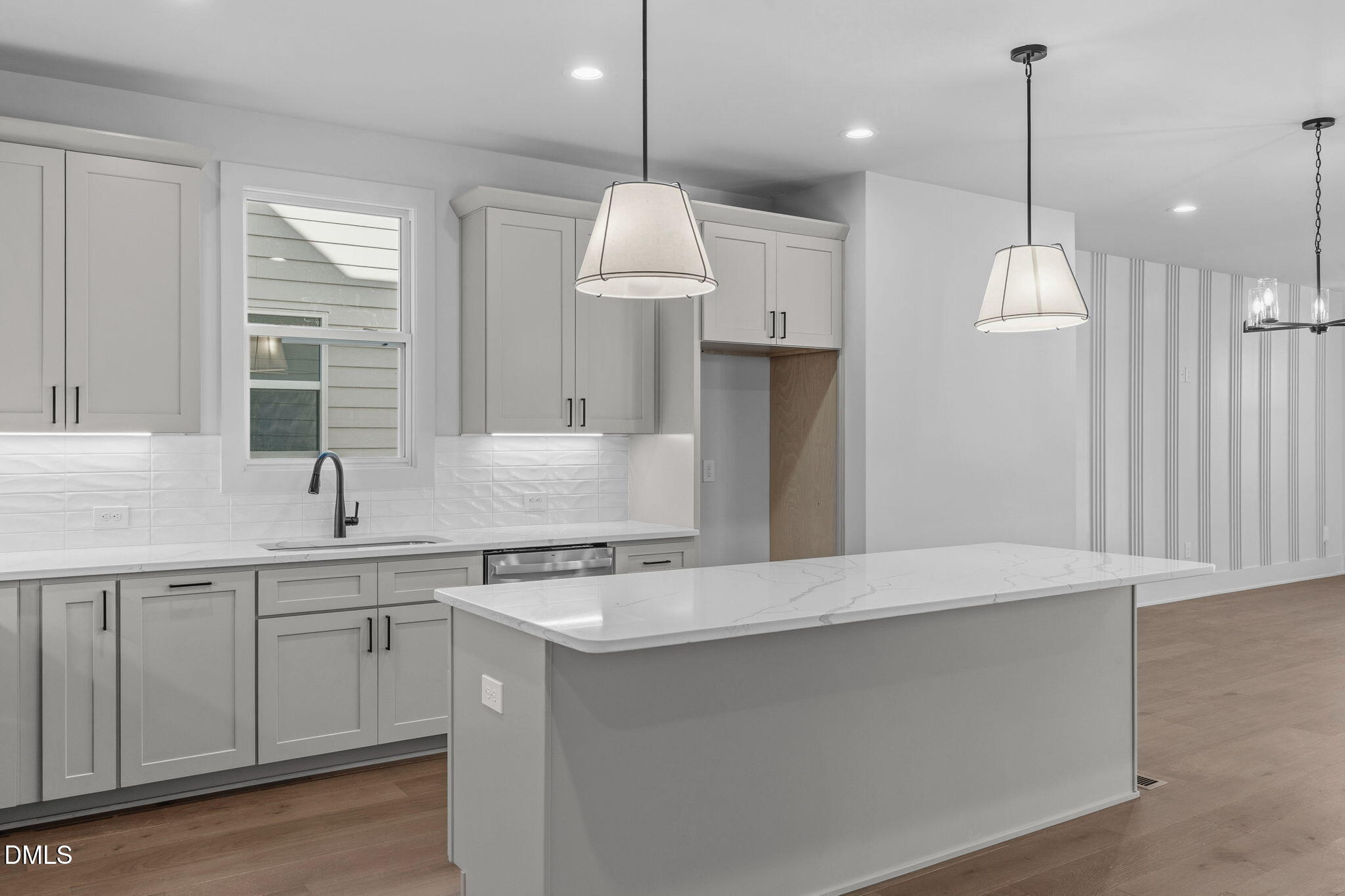 635 Conover Road, Unit B Durham, NC 27703 - Photo 1 of 48 a kitchen with a sink chandelier and refrigerator
