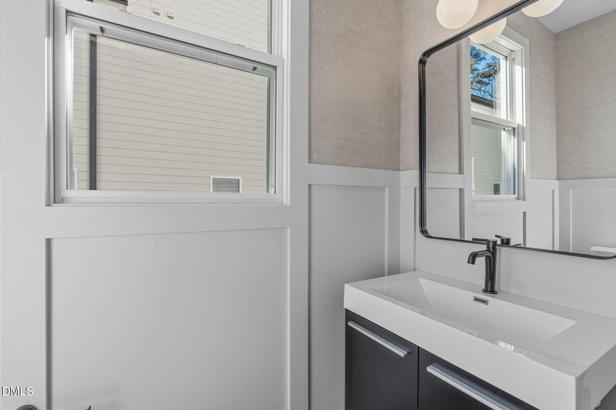 635 Conover Road, Unit B Durham, NC 27703 - Photo 10 of 48 a bathroom with a sink and a mirror