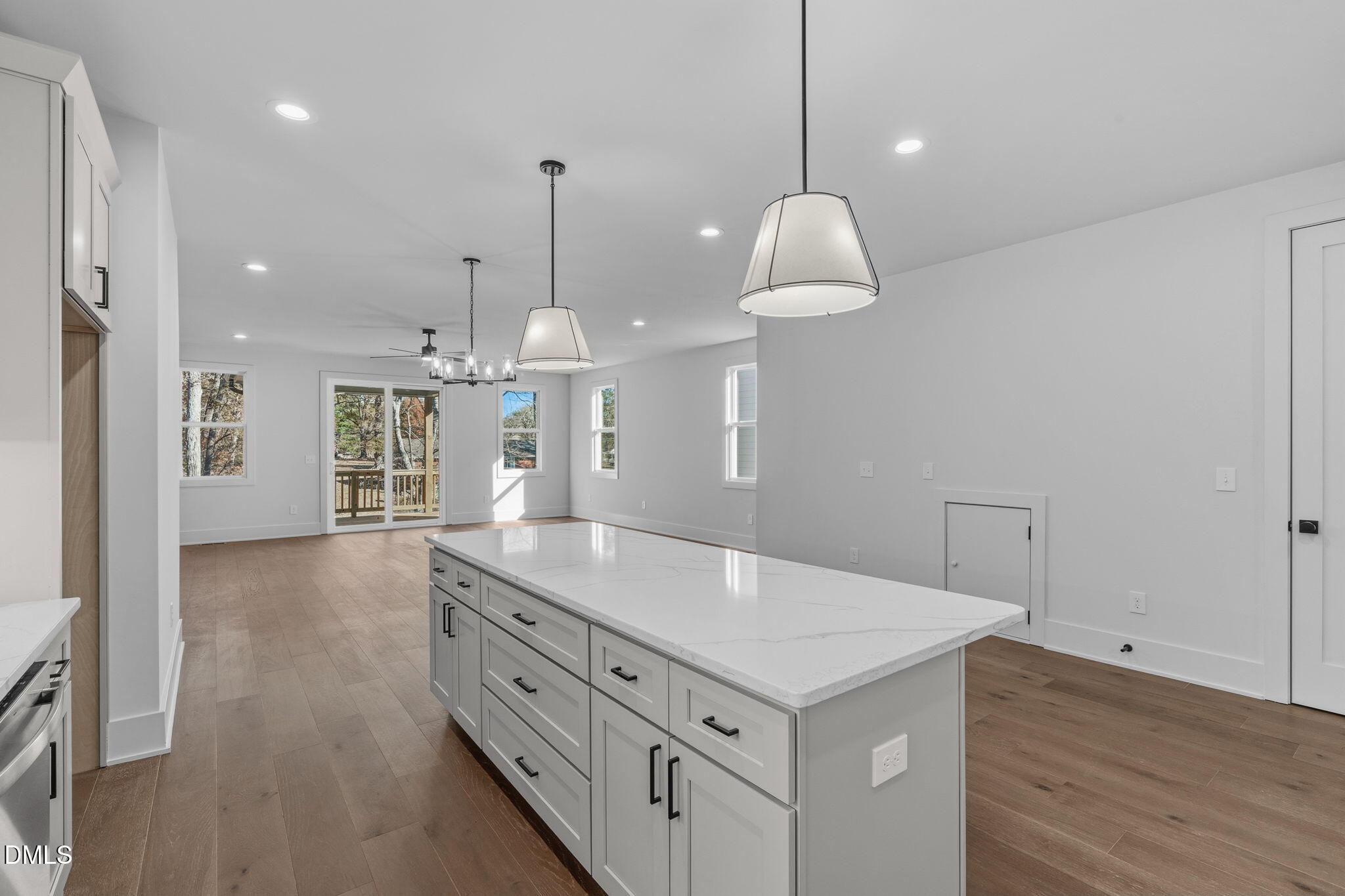 635 Conover Road, Unit B Durham, NC 27703 - Photo 16 of 48 a kitchen with a counter space window and wooden floor