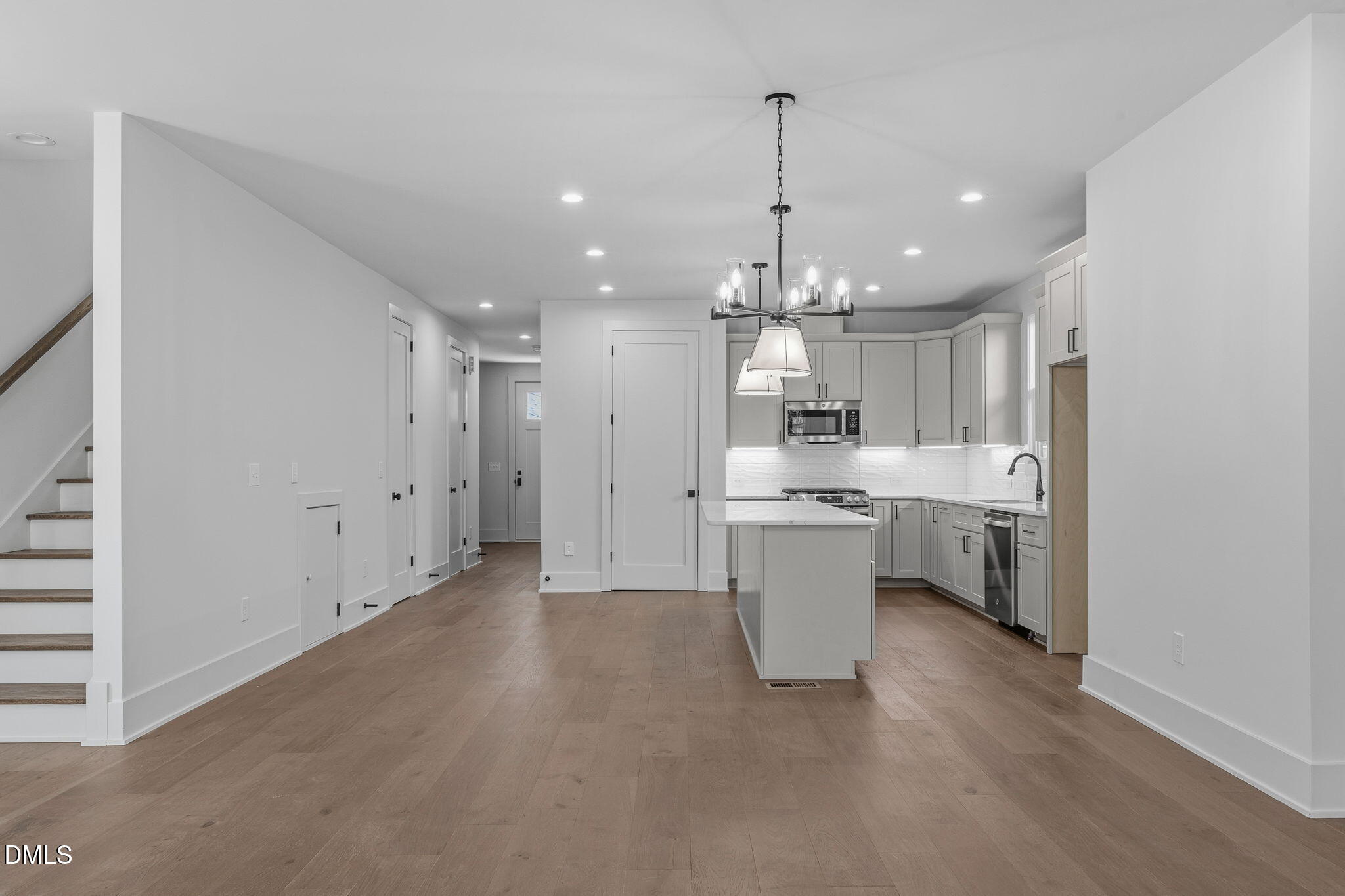 635 Conover Road, Unit B Durham, NC 27703 - Photo 17 of 48 a large kitchen with a sink stainless steel appliances and cabinets