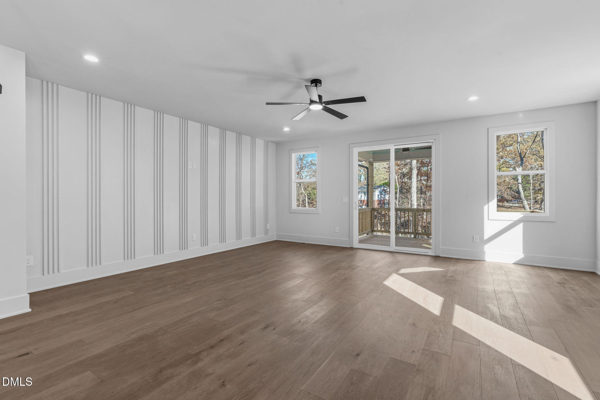 635 Conover Road, Unit B Durham, NC 27703 - Photo 19 of 48 a view of an empty room with a window and wooden floor