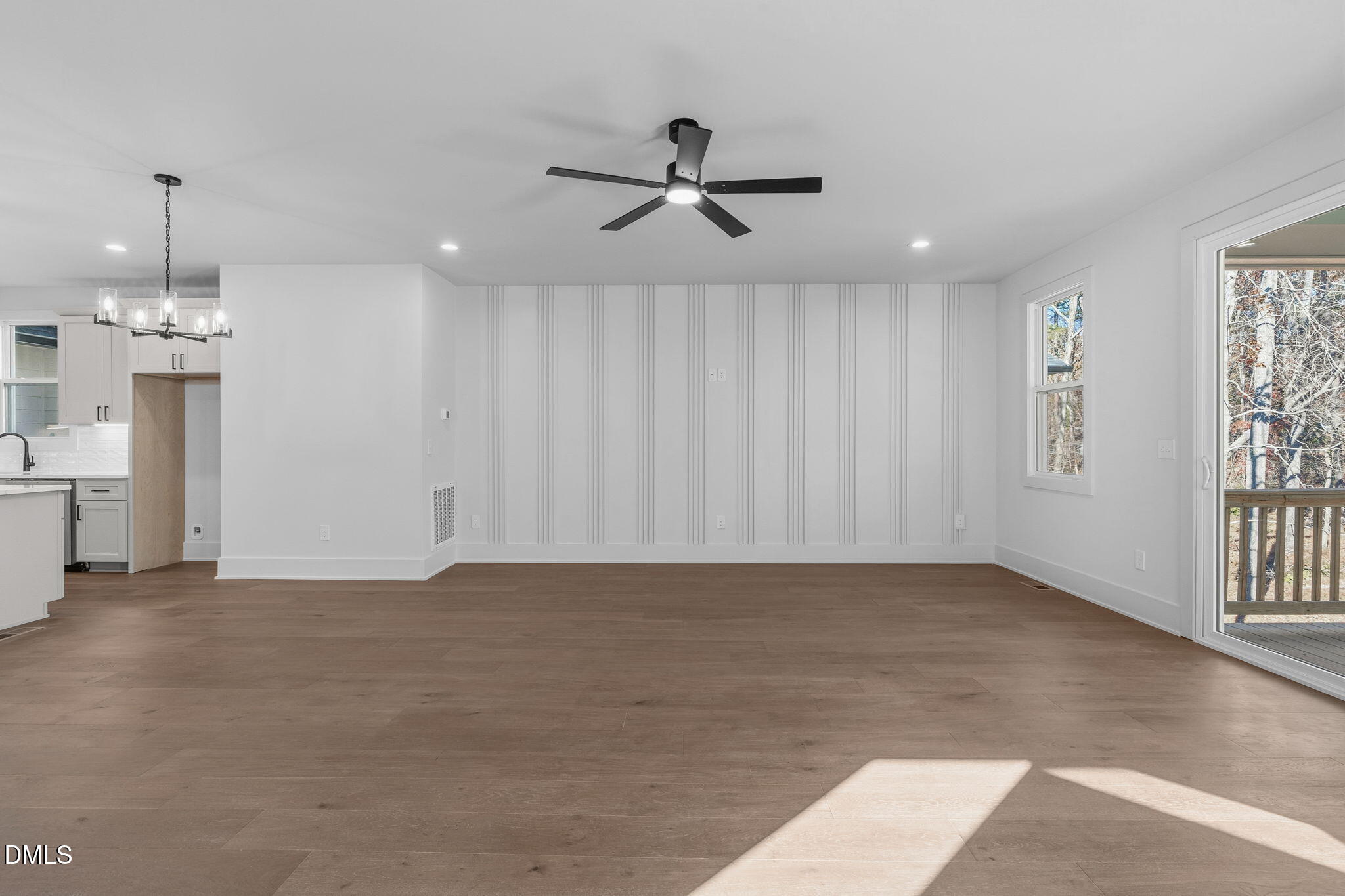635 Conover Road, Unit B Durham, NC 27703 - Photo 20 of 48 an empty room with windows and ceiling fan