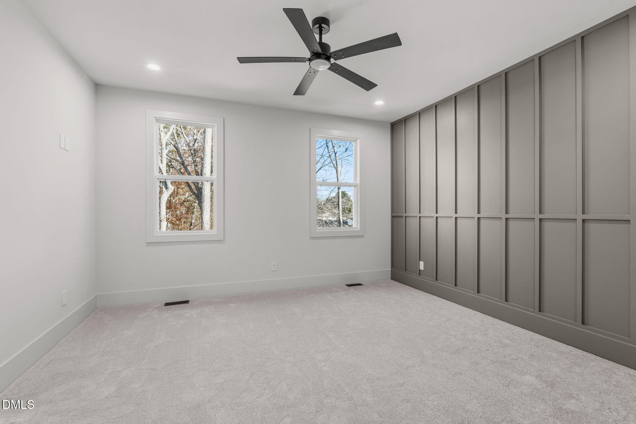 635 Conover Road, Unit B Durham, NC 27703 - Photo 25 of 48 an empty room with windows and fan