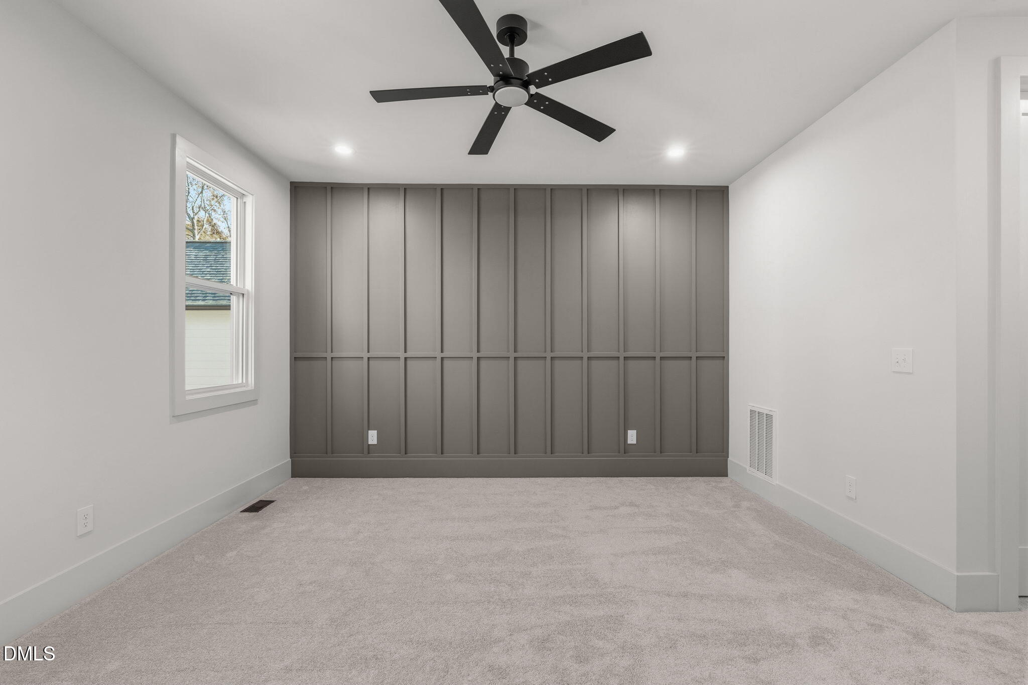 635 Conover Road, Unit B Durham, NC 27703 - Photo 26 of 48 an empty room with windows and fan