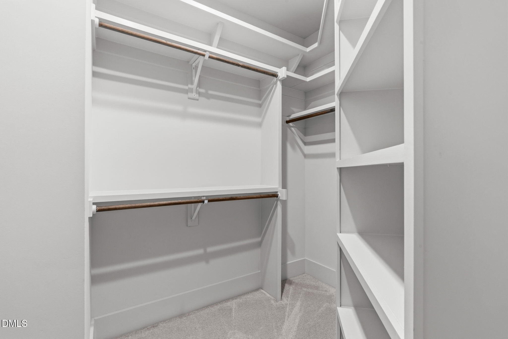 635 Conover Road, Unit B Durham, NC 27703 - Photo 29 of 48 a view of walk in closet with empty racks