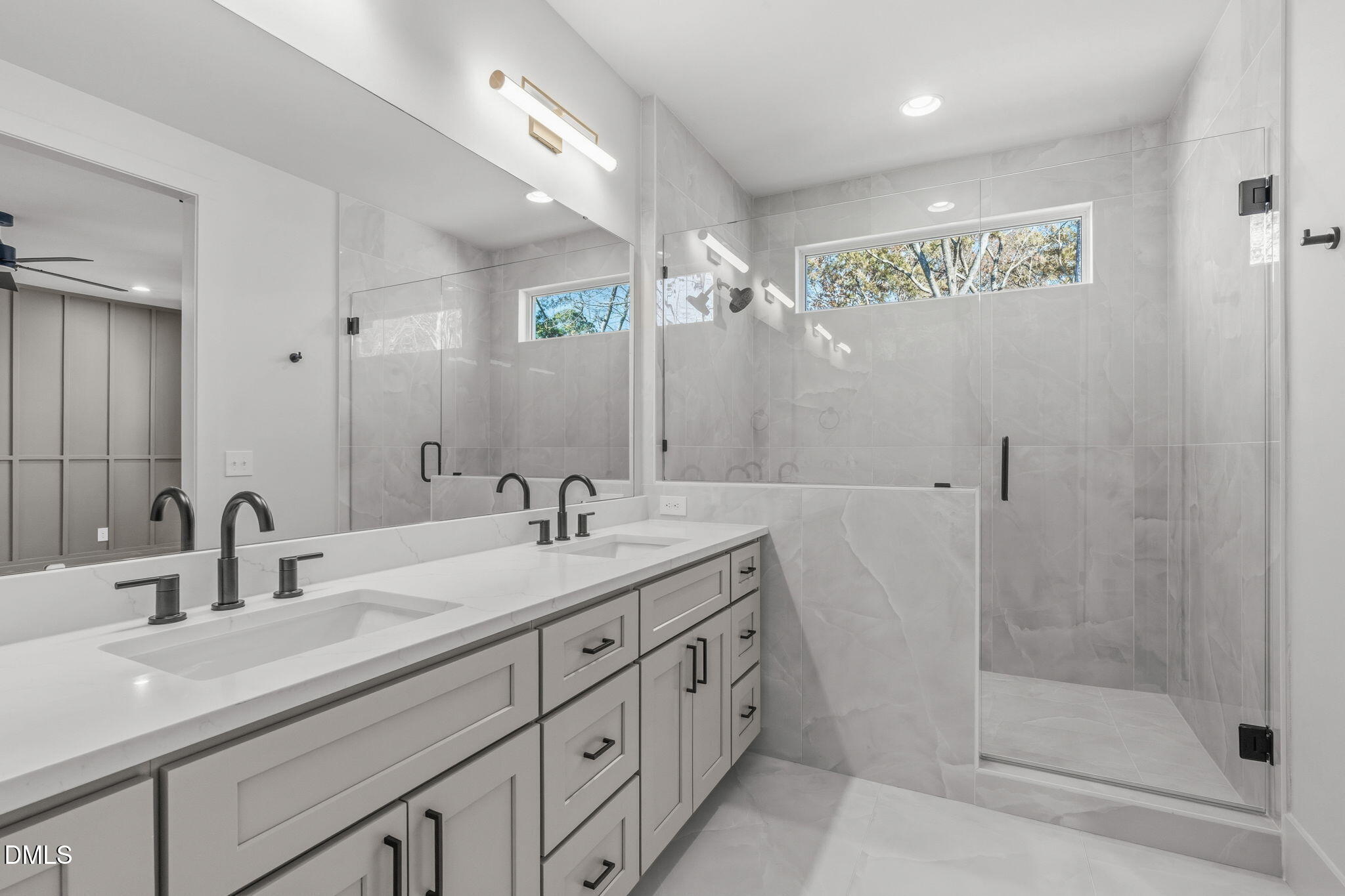 635 Conover Road, Unit B Durham, NC 27703 - Photo 2 of 48 a bathroom with double sink and a mirror