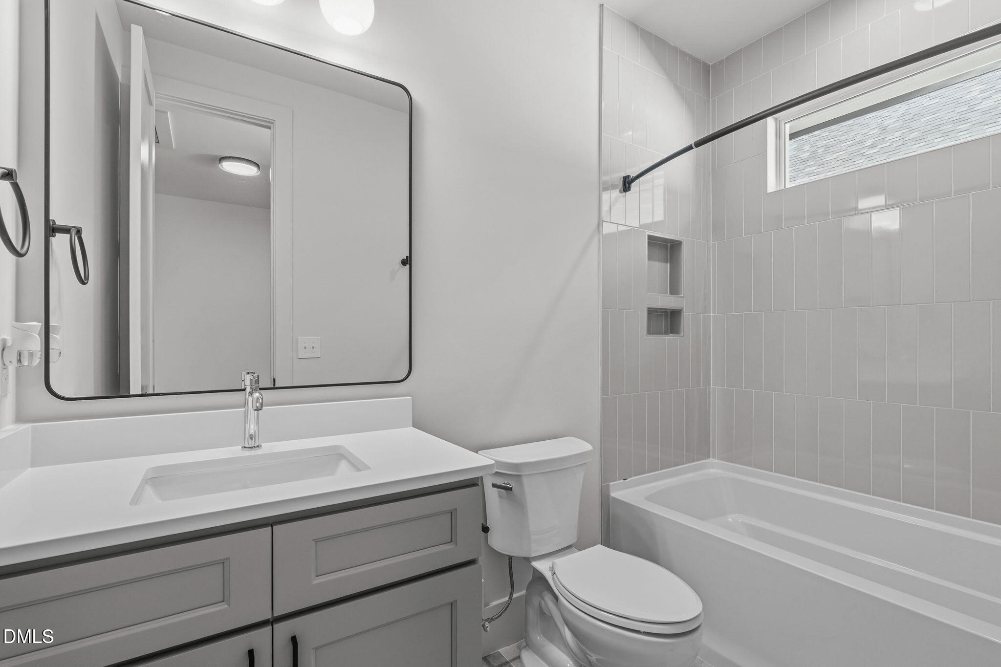 635 Conover Road, Unit B Durham, NC 27703 - Photo 33 of 48 a bathroom with a sink toilet and shower