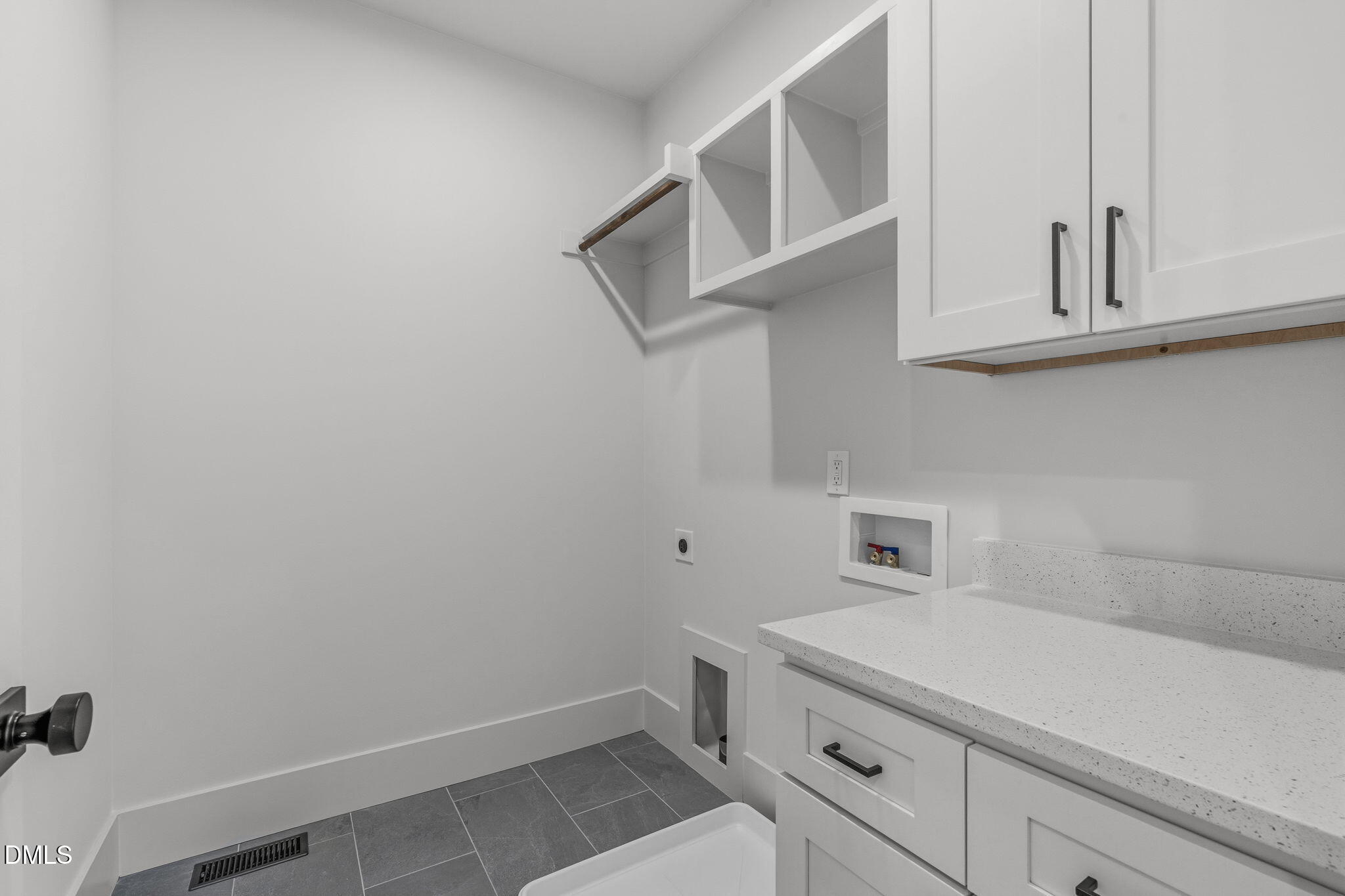 635 Conover Road, Unit B Durham, NC 27703 - Photo 34 of 48 a bathroom with a sink and cabinets
