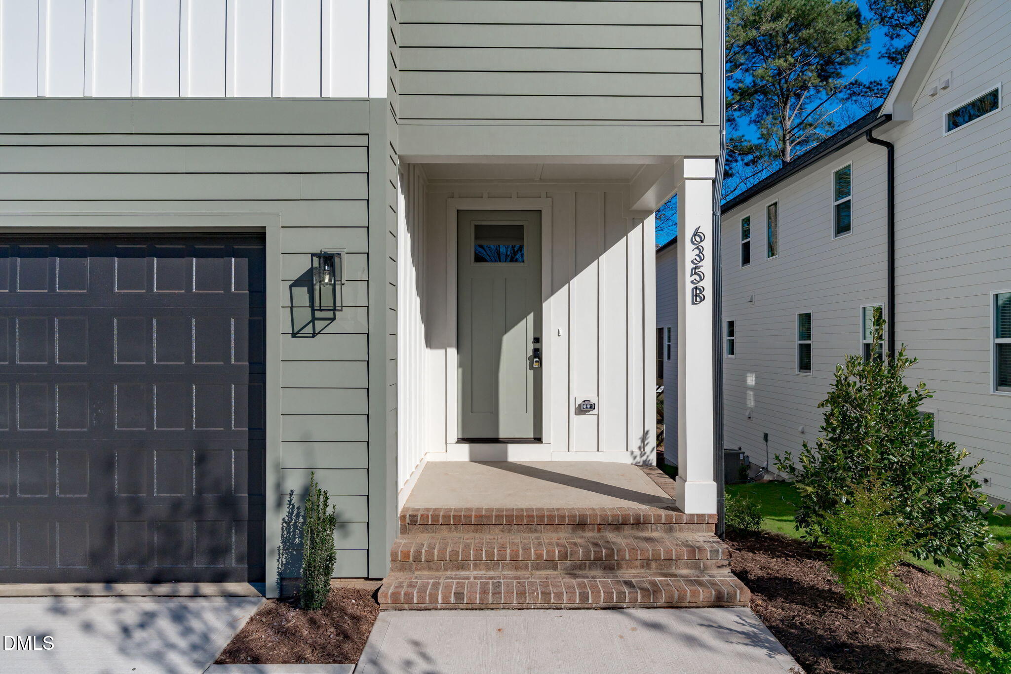 635 Conover Road, Unit B Durham, NC 27703 - Photo 6 of 48 a front view of a house with a garden