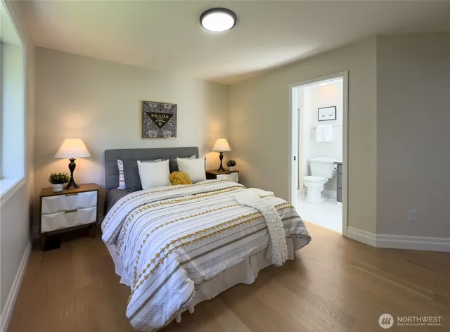 a bedroom with a bed and a night stand