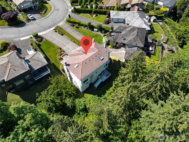 an aerial view of residential house with outdoor space and swimming pool