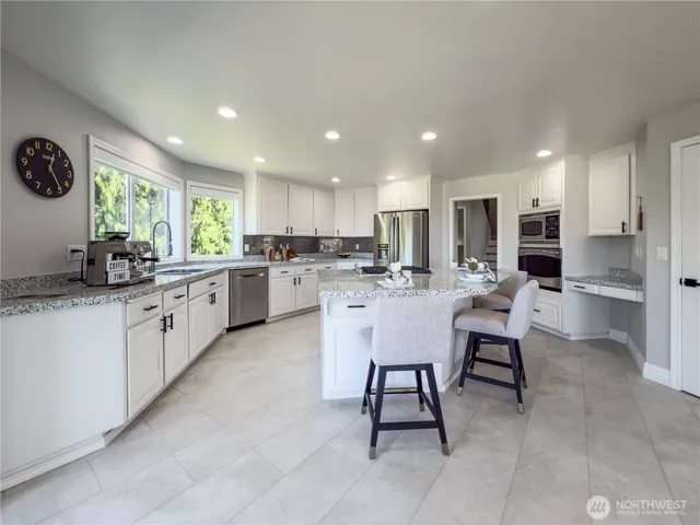 a kitchen with a sink cabinets and window