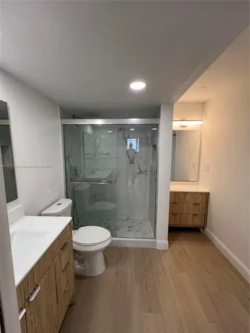 a bathroom with a toilet sink and a shower