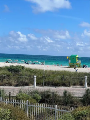a view of a street with a yard