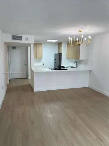 a view of a kitchen with a sink