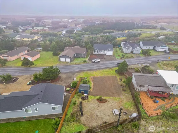 an aerial view of a house with a swimming pool
