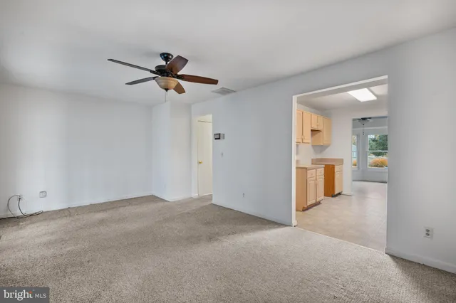 a view of a kitchen with a sink and a kitchen view