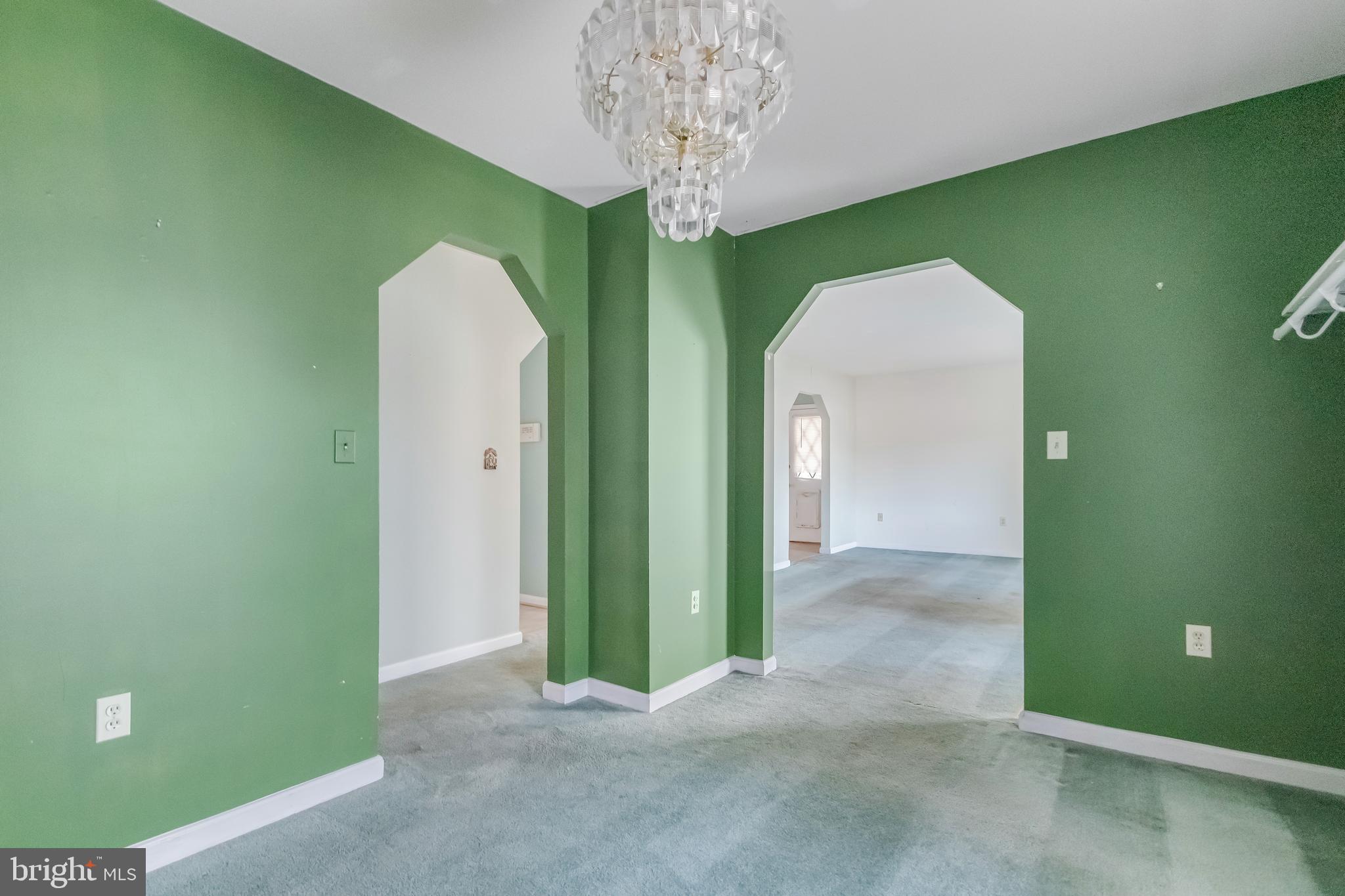 1104 Saffron Way Owings, MD 20736 - Photo 15 of 26 a view of a room that has a chandelier fan and closet