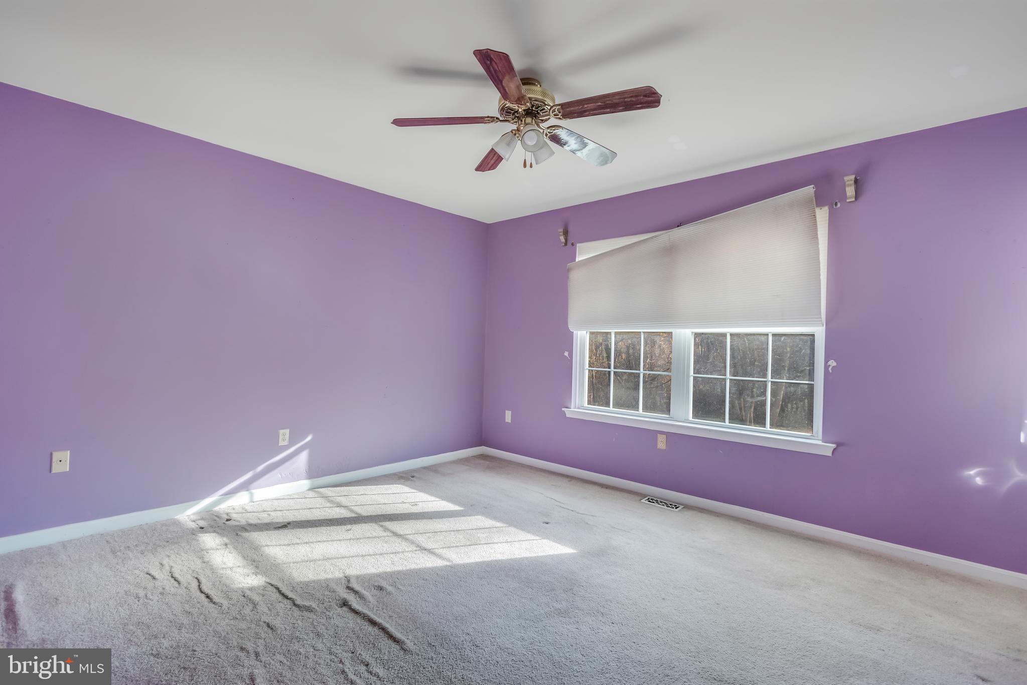 1104 Saffron Way Owings, MD 20736 - Photo 16 of 26 a view of a livingroom with a ceiling fan and window