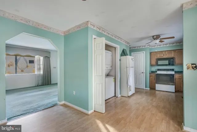 a kitchen with a sink cabinets and window
