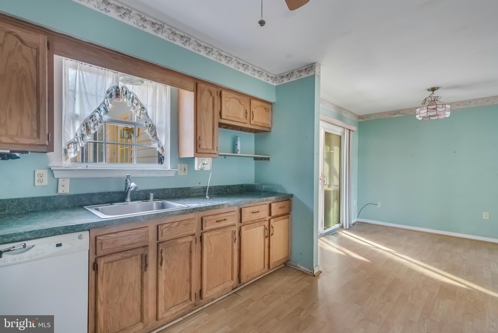 1104 Saffron Way Owings, MD 20736 - Photo 8 of 26 a kitchen with a sink cabinets and window