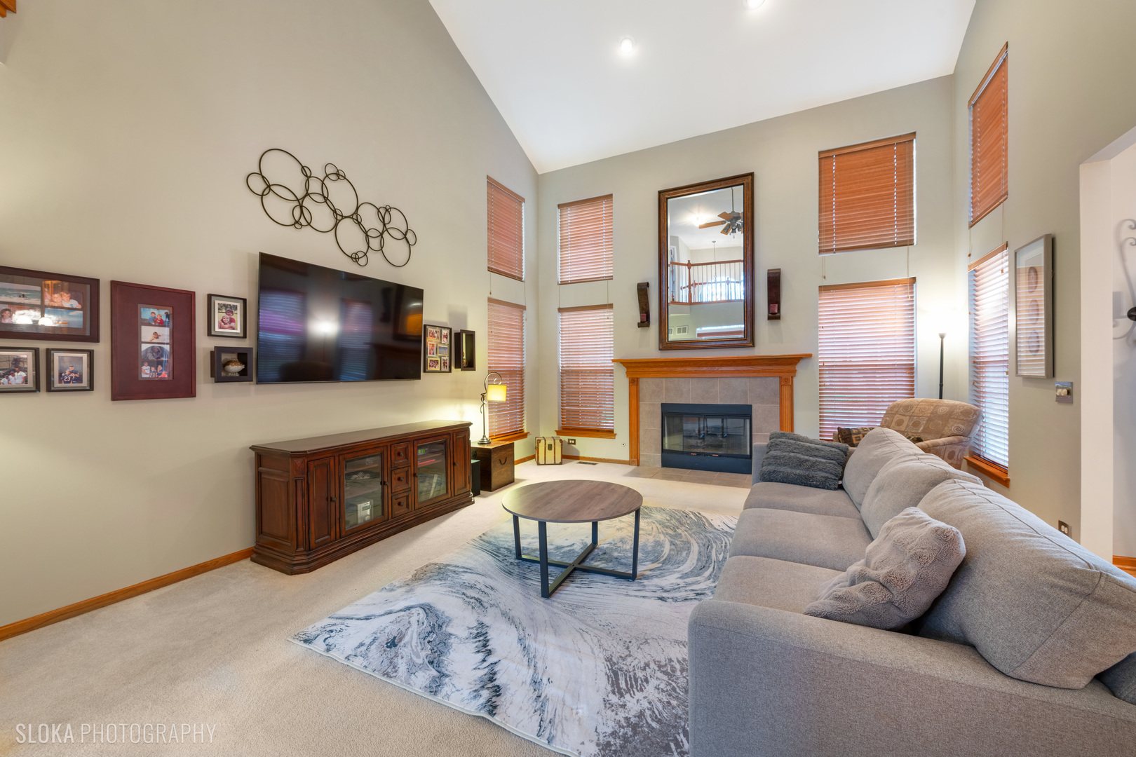 1123 Village Road Crystal Lake, IL 60014 - Photo 13 of 46 a living room with furniture a flat screen tv and a fireplace