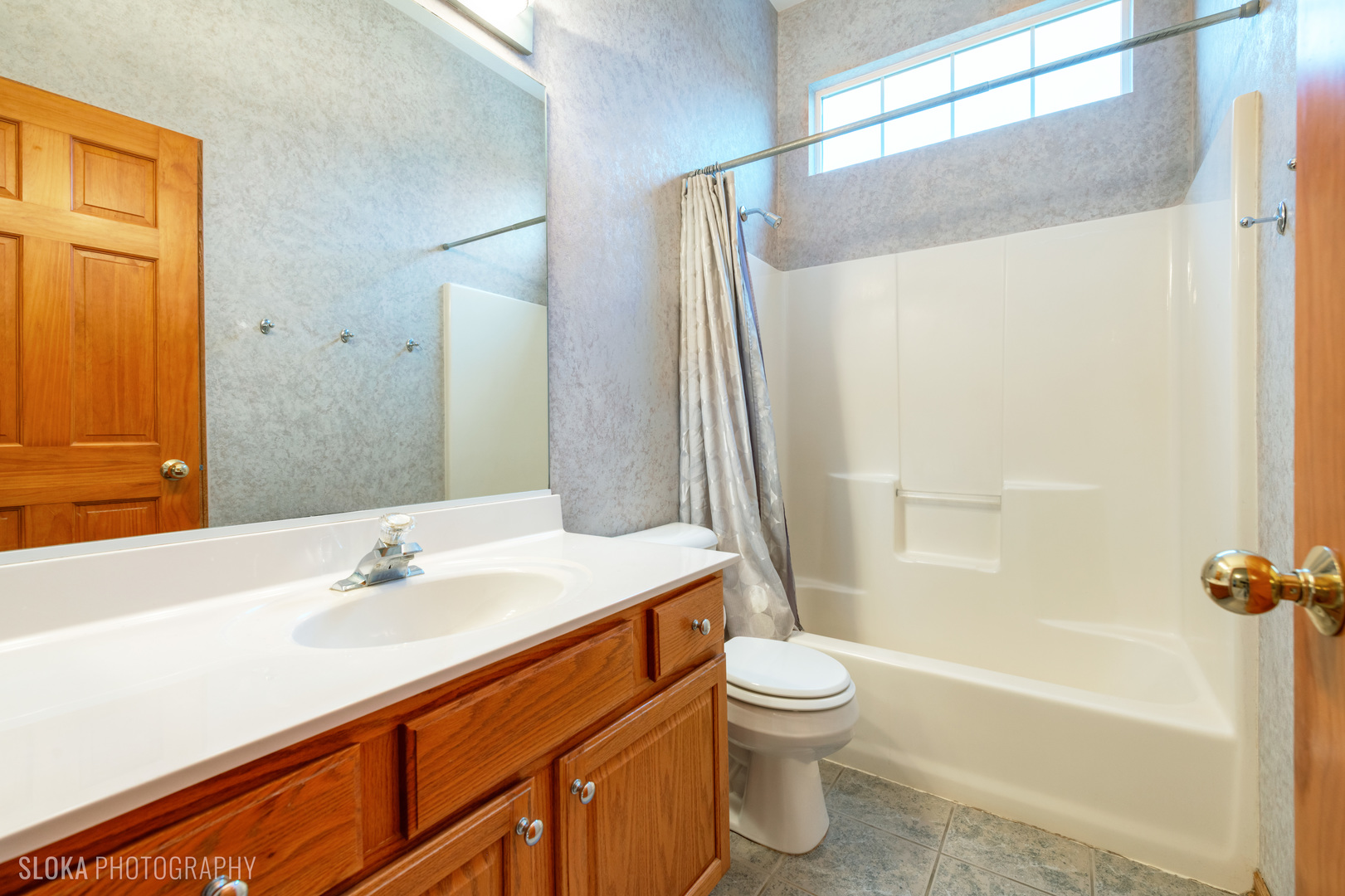 1123 Village Road Crystal Lake, IL 60014 - Photo 23 of 46 a bathroom with a sink a toilet and shower