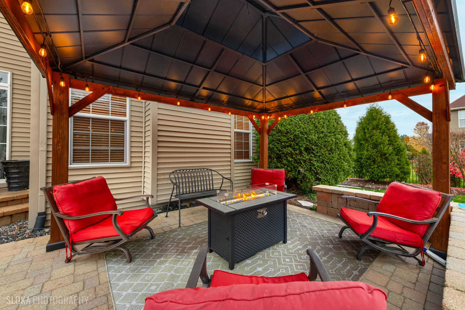1123 Village Road Crystal Lake, IL 60014 - Photo 38 of 46 a view of a outdoor sitting area with furniture and a umbrella