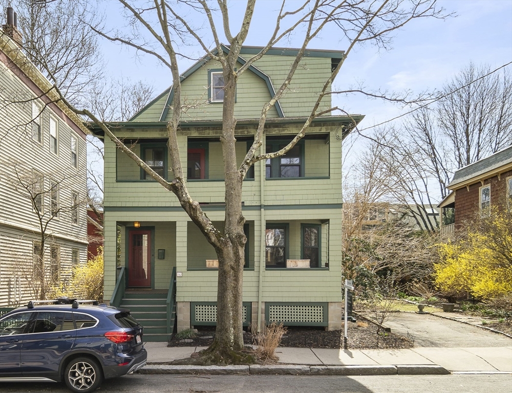 a front view of a house with parking space