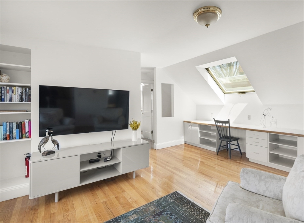 40 Eustis Street Cambridge, MA 02140 - Photo 14 of 23 a living room with furniture and a flat screen tv