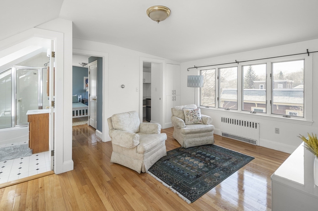 40 Eustis Street Cambridge, MA 02140 - Photo 15 of 23 a living room with furniture and a large window