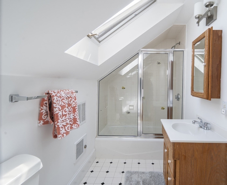 40 Eustis Street Cambridge, MA 02140 - Photo 18 of 23 a bathroom with a sink a toilet and shower