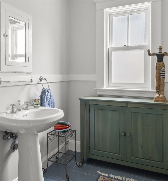 40 Eustis Street Cambridge, MA 02140 - Photo 19 of 23 a bathroom with a sink and a mirror