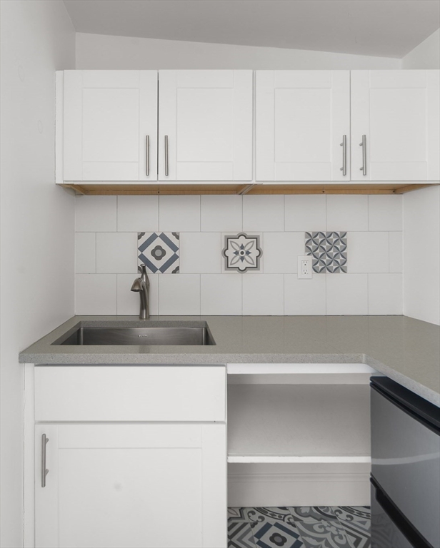 40 Eustis Street Cambridge, MA 02140 - Photo 20 of 23 a close view of sink and cabinets