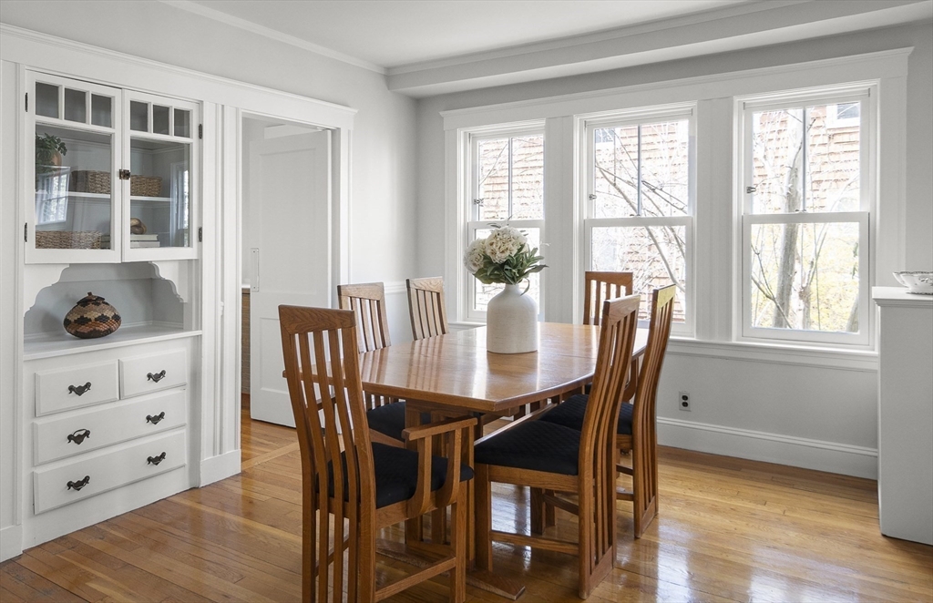 40 Eustis Street Cambridge, MA 02140 - Photo 3 of 23 a view of a dining room with furniture and wooden floor