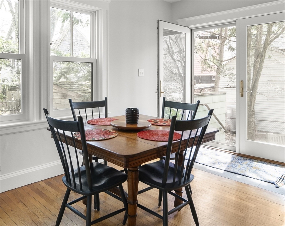 40 Eustis Street Cambridge, MA 02140 - Photo 6 of 23 a view of a dining room with furniture window and wooden floor