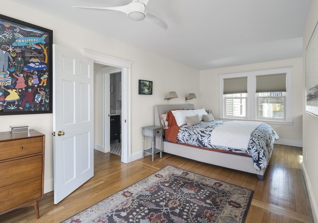 40 Eustis Street Cambridge, MA 02140 - Photo 8 of 23 a bedroom with a bed and wooden floor