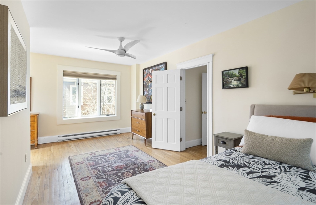 40 Eustis Street Cambridge, MA 02140 - Photo 9 of 23 a bedroom with a bed and wooden floor