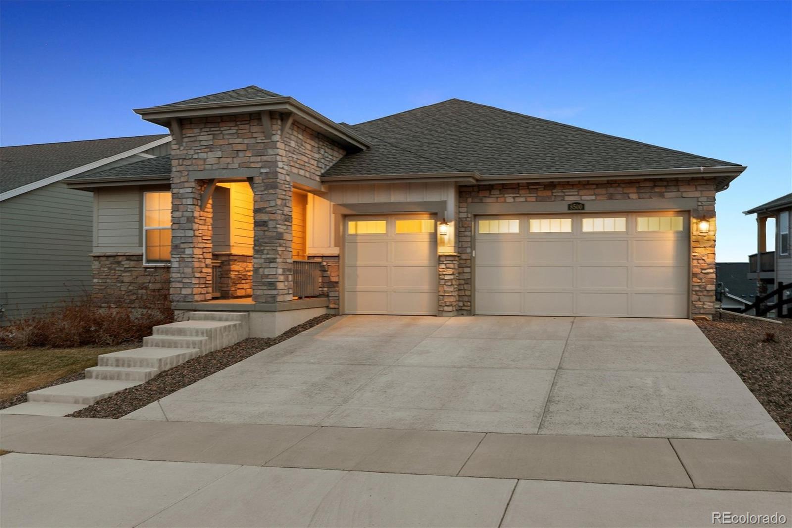 8500 South Riviera Court Aurora, CO 80016 - Photo 2 of 35 a front view of a house with a yard