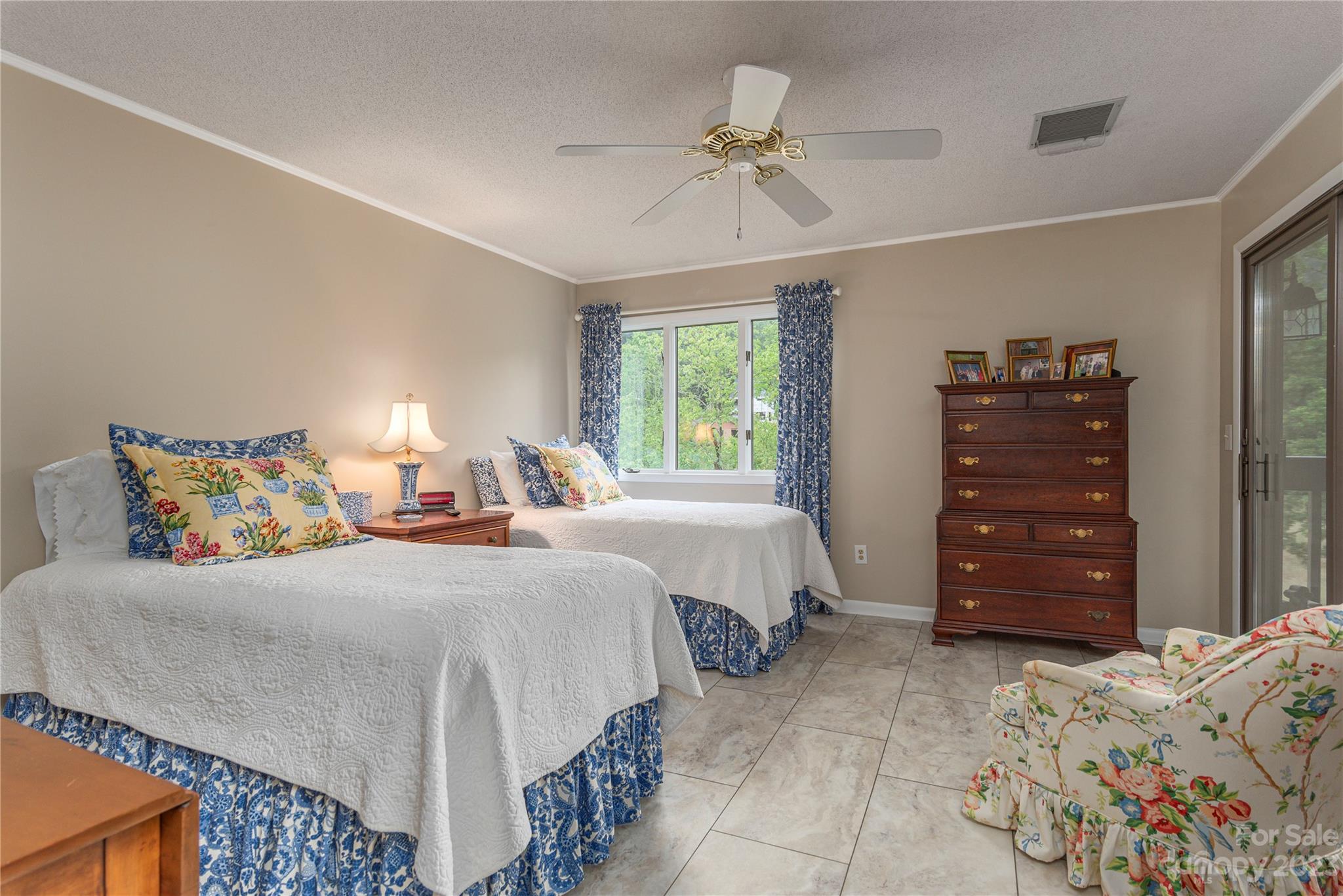 87 Willow Road, Unit D12 Waynesville, NC 28786 - Photo 13 of 21 a bedroom with a bed and a dresser