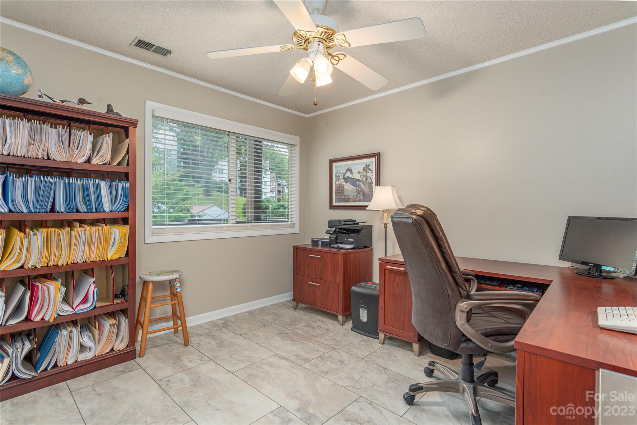 87 Willow Road, Unit D12 Waynesville, NC 28786 - Photo 15 of 21 a view of a workspace with furniture and a book shelf