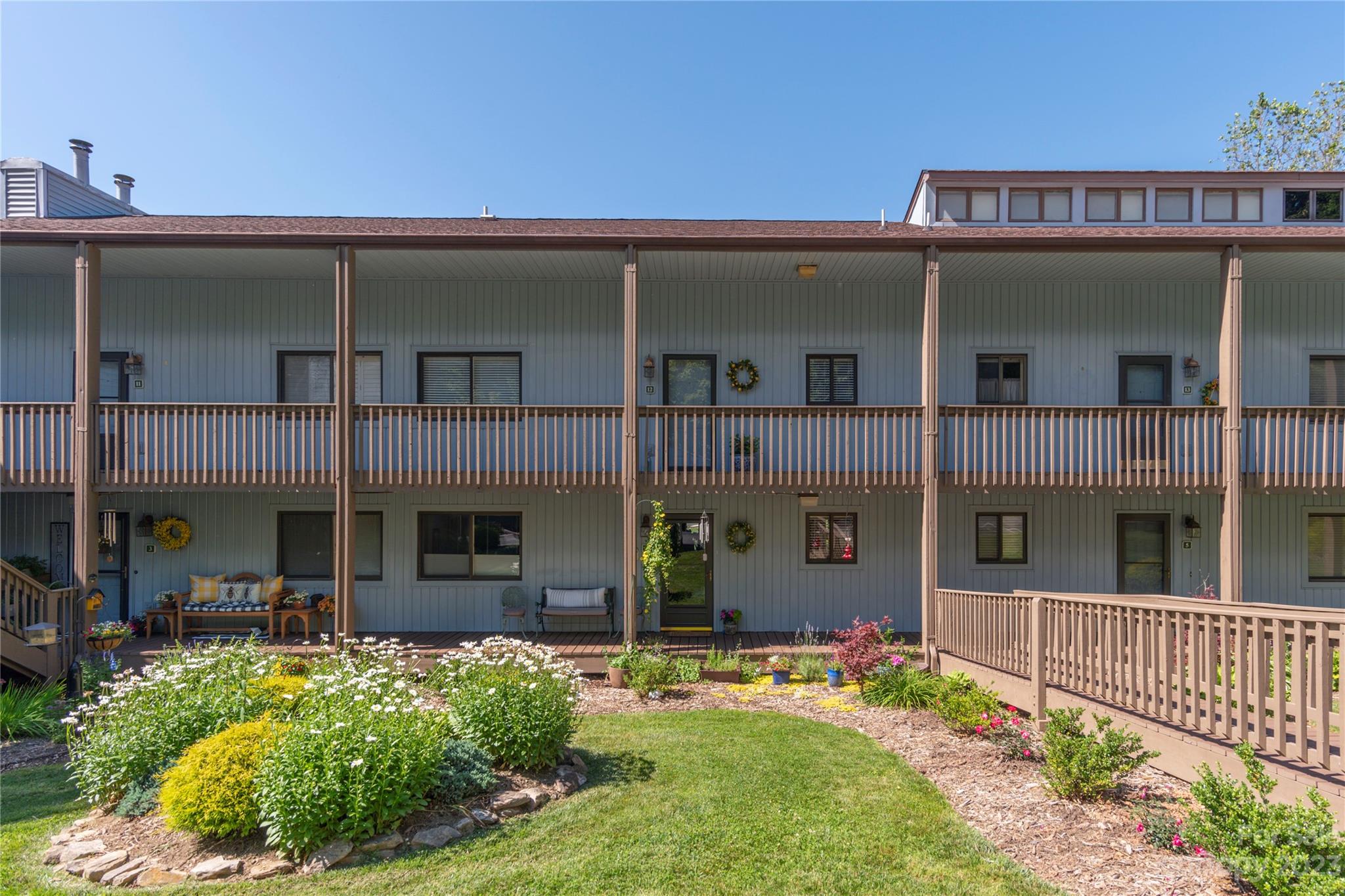 87 Willow Road, Unit D12 Waynesville, NC 28786 - Photo 17 of 21 front view of a house with a yard