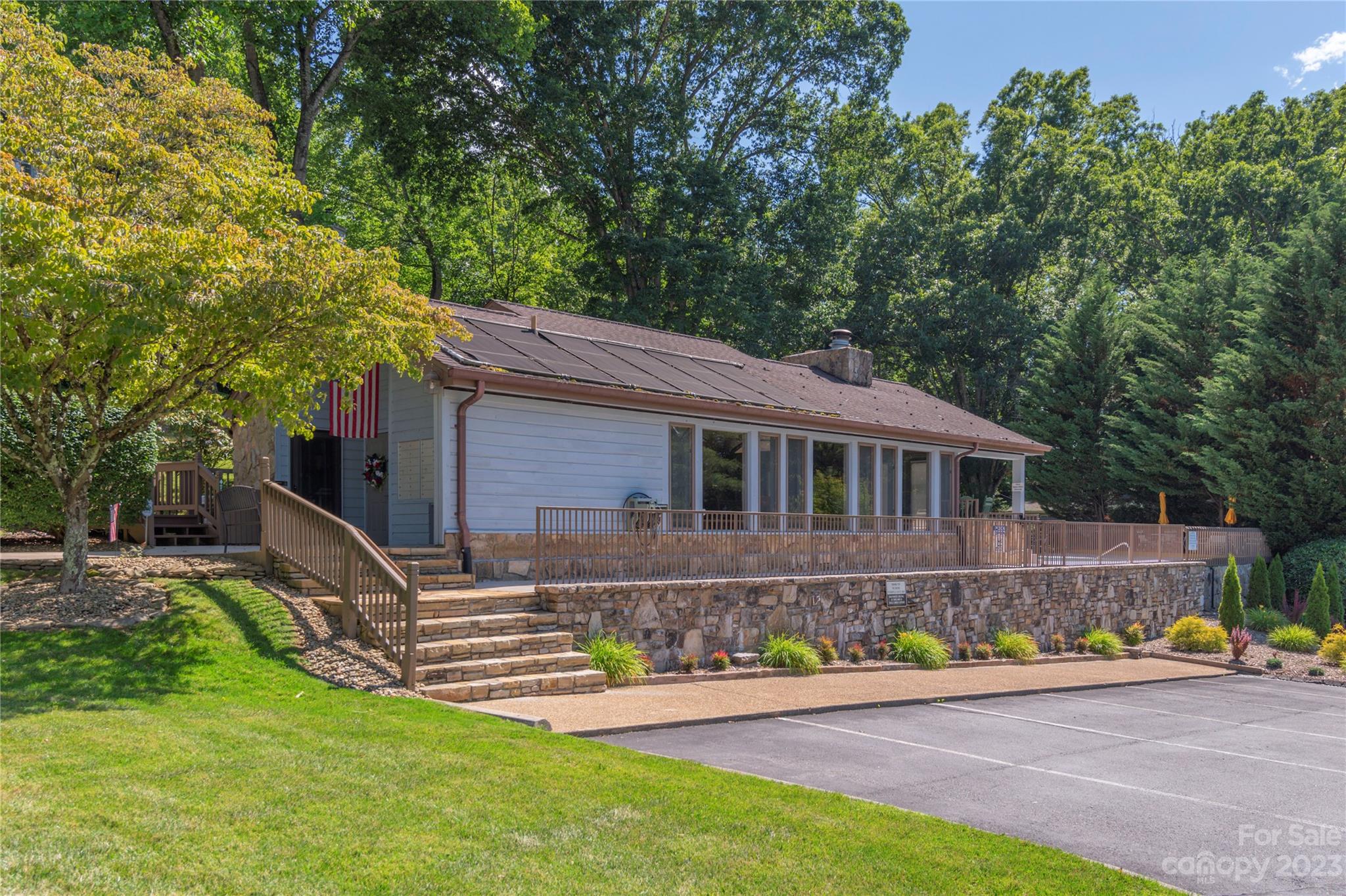 87 Willow Road, Unit D12 Waynesville, NC 28786 - Photo 20 of 21 a front view of a house with a garden