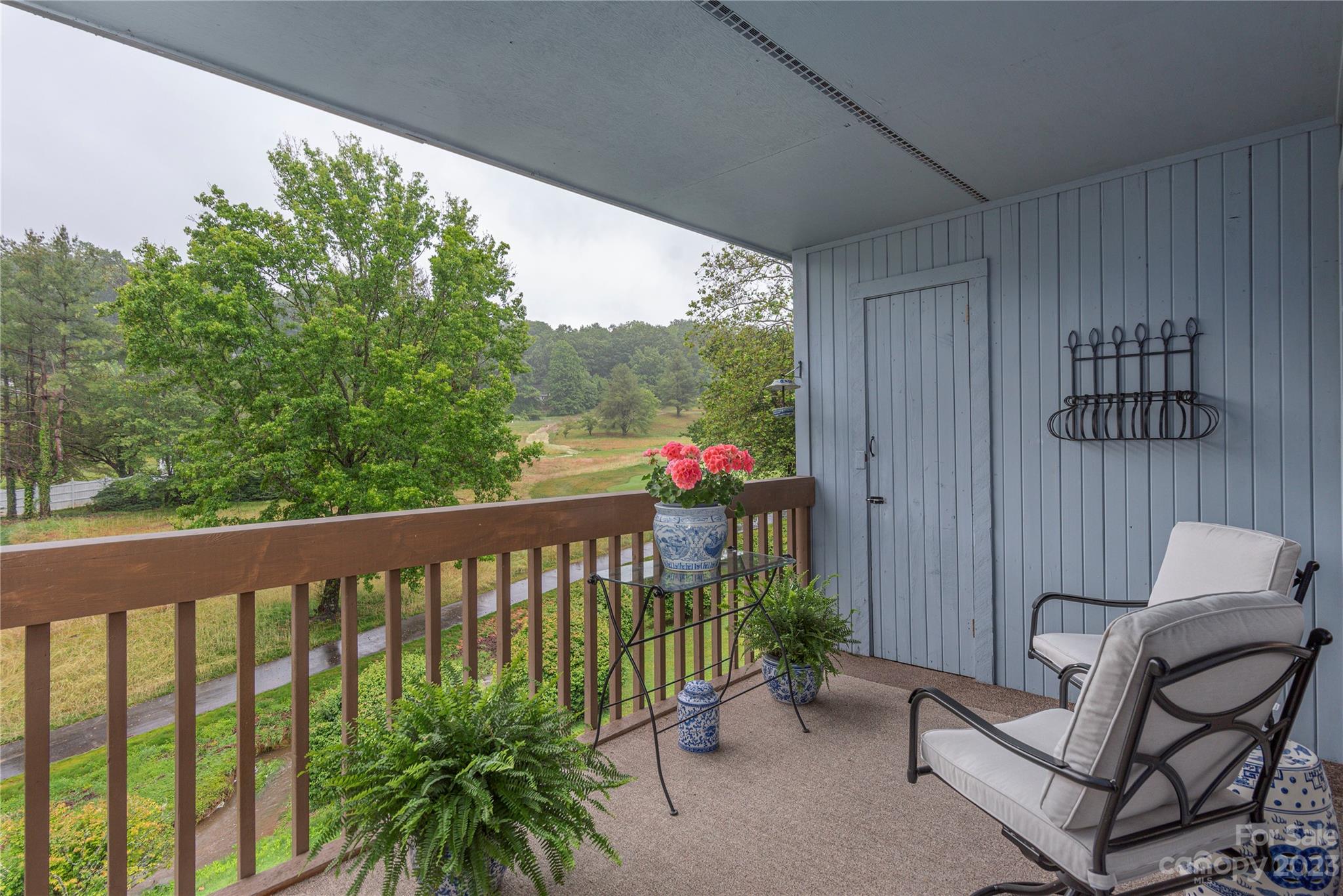 87 Willow Road, Unit D12 Waynesville, NC 28786 - Photo 2 of 21 a view of a balcony with furniture