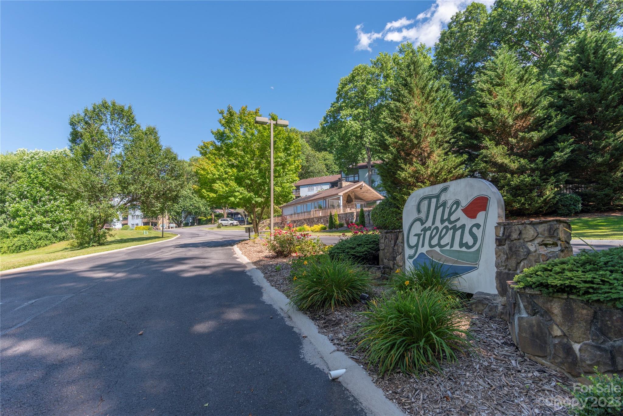 87 Willow Road, Unit D12 Waynesville, NC 28786 - Photo 21 of 21 a sign that is on the side of a road