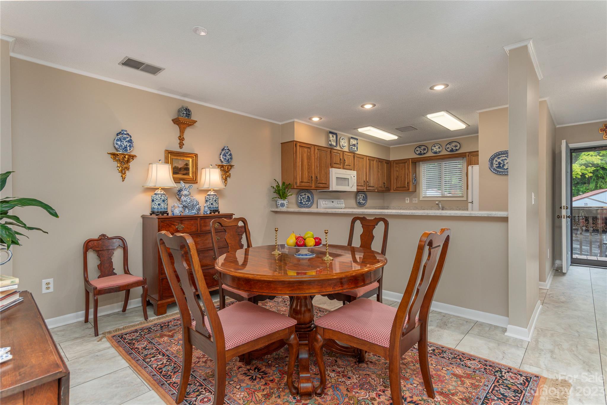 87 Willow Road, Unit D12 Waynesville, NC 28786 - Photo 8 of 21 a dining room with a table and chairs