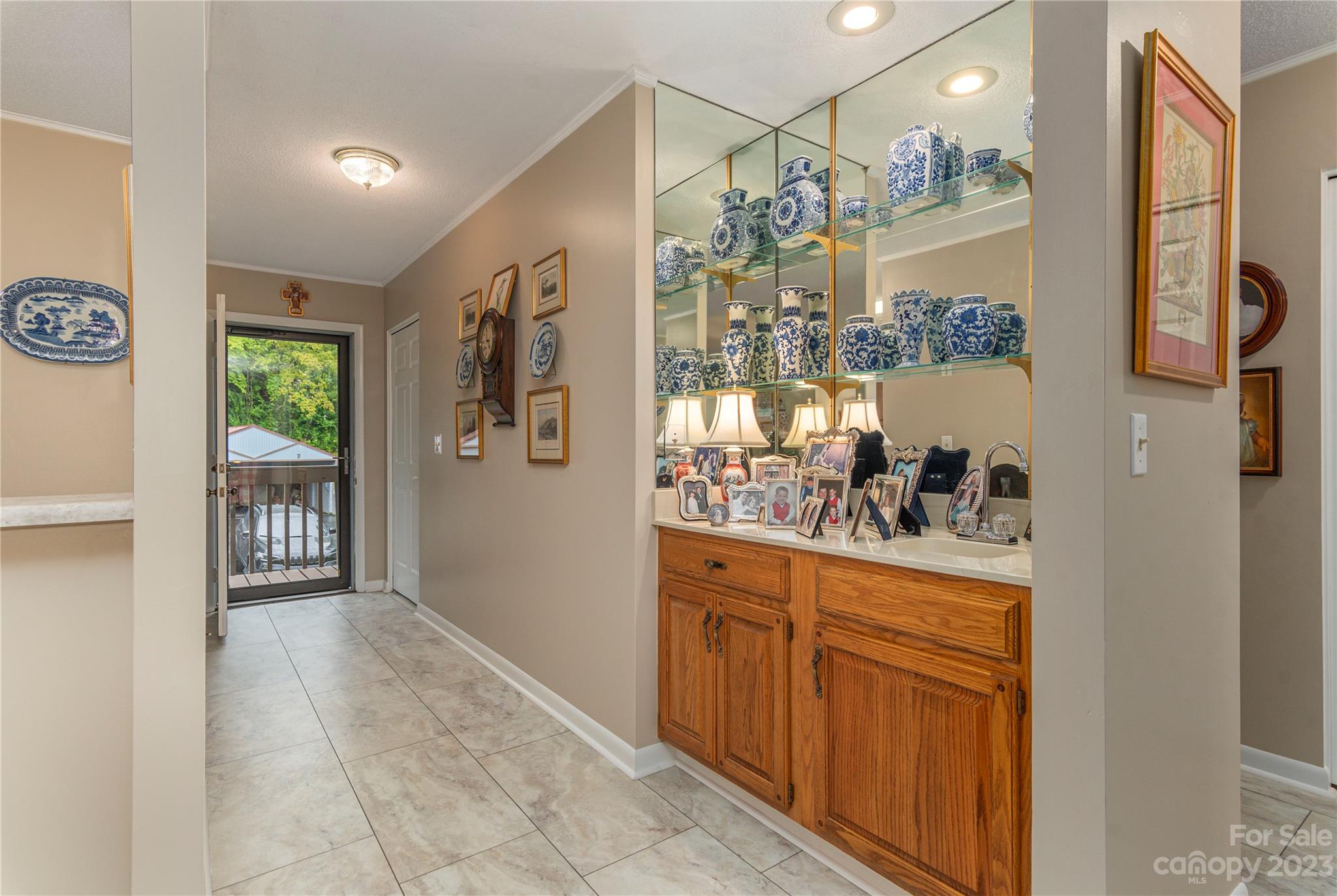 87 Willow Road, Unit D12 Waynesville, NC 28786 - Photo 10 of 21 a kitchen with stainless steel appliances granite countertop a refrigerator and a stove top oven