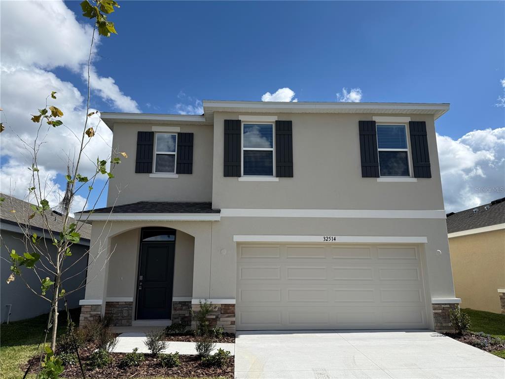 a front view of a house with parking