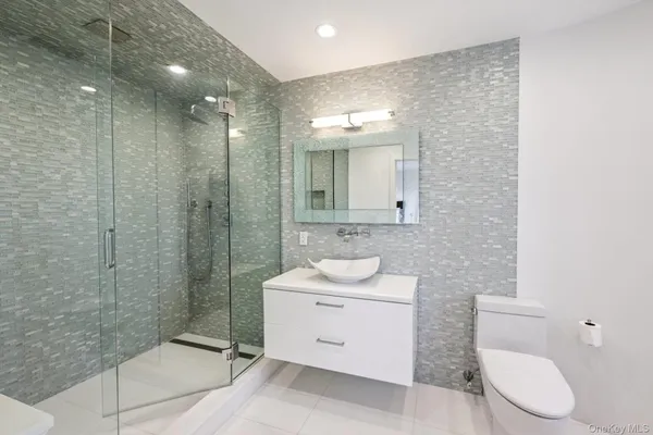 a bedroom with a bed and cupboard